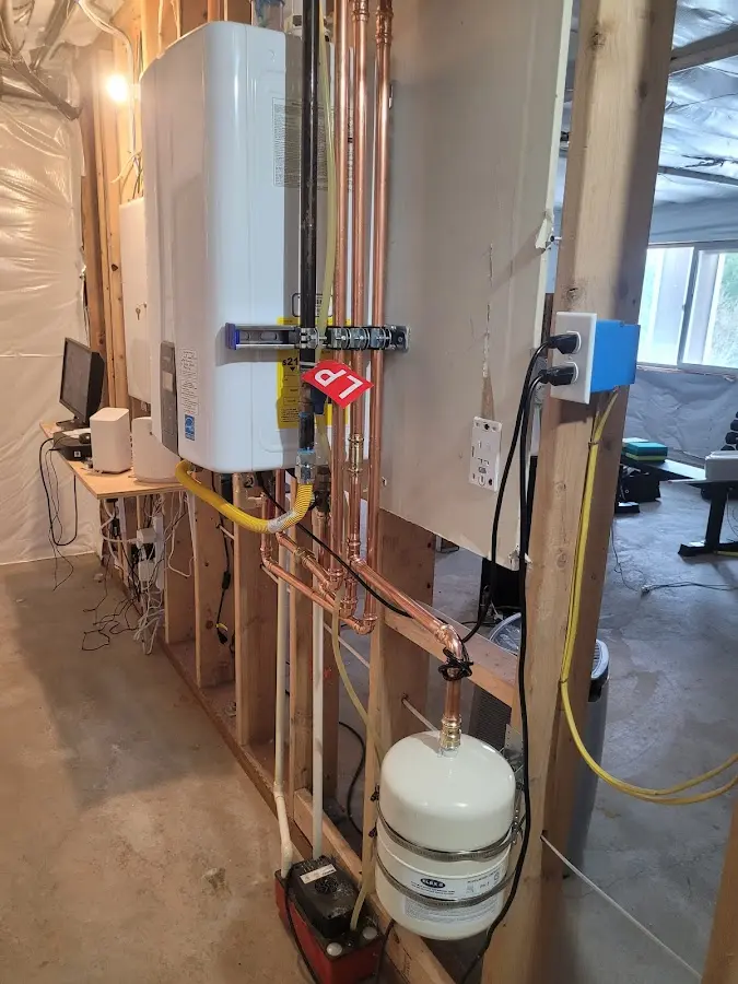 Licensed plumber repairing a kitchen sink in Menands